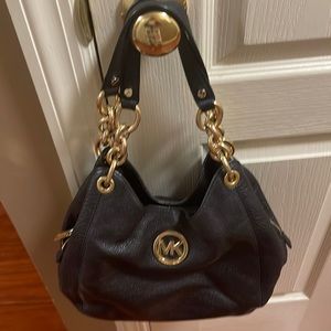 Black leather Michael Kors handbag.